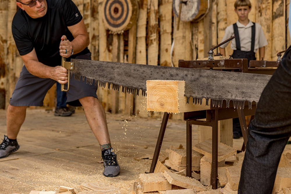 Lumberjack demonstration at Hochstetler Log Homes Log Cabin Days